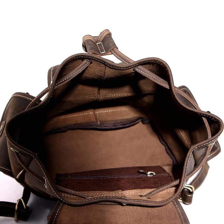 Leather Acadia Backpack open showing empty large compartment for carrying personal belongings