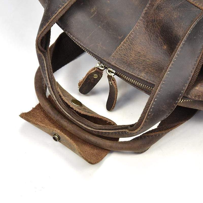 close up picture of leather handles on Carter duffle Bag