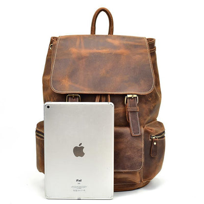 Hamilton leather backpack in upright position with apple laptop computer standing upright alongside backpack