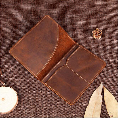 Pineland leather passport cover open on table with nothing inside