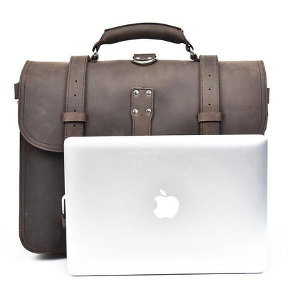 Cumberland messenger bag upright with laptop computer leaning against it