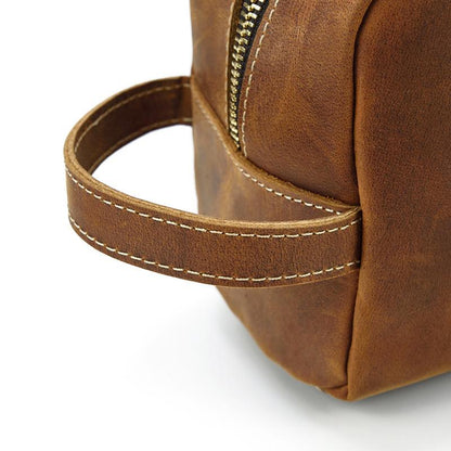 Side view of leather handle on a Rio toiletry bag for men