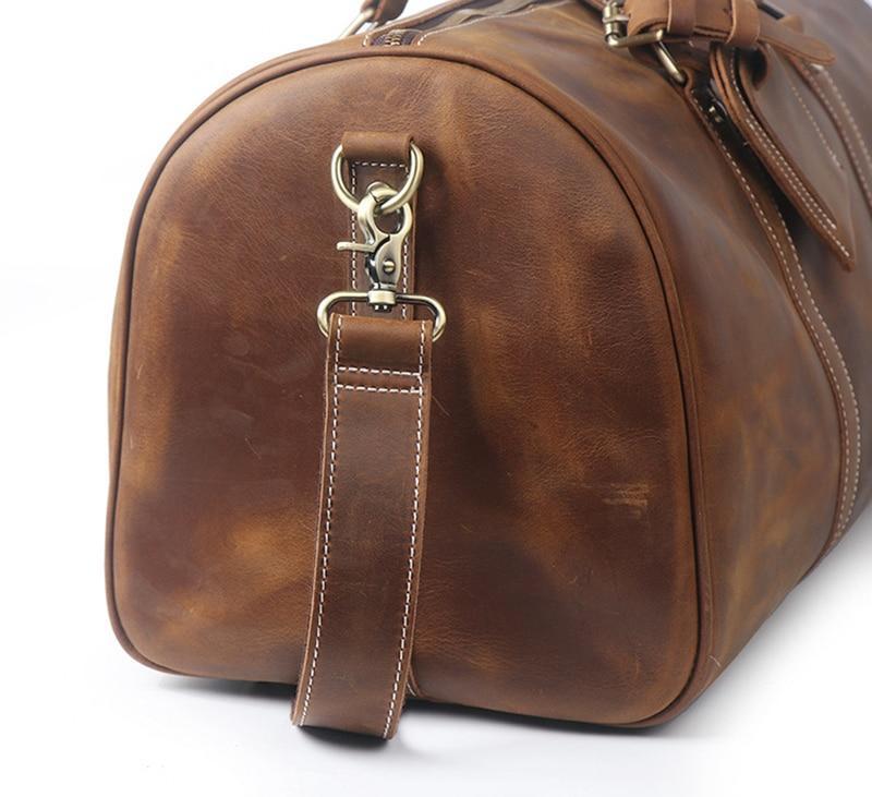 Side view of Rushmore Duffle bag showing strong brass metal claps for should strap